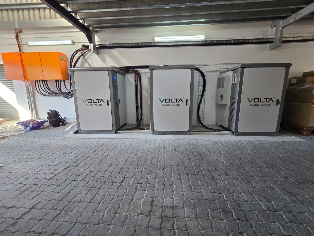 Large commercial rooftop solar array on corrugated metal roof — Western Cape