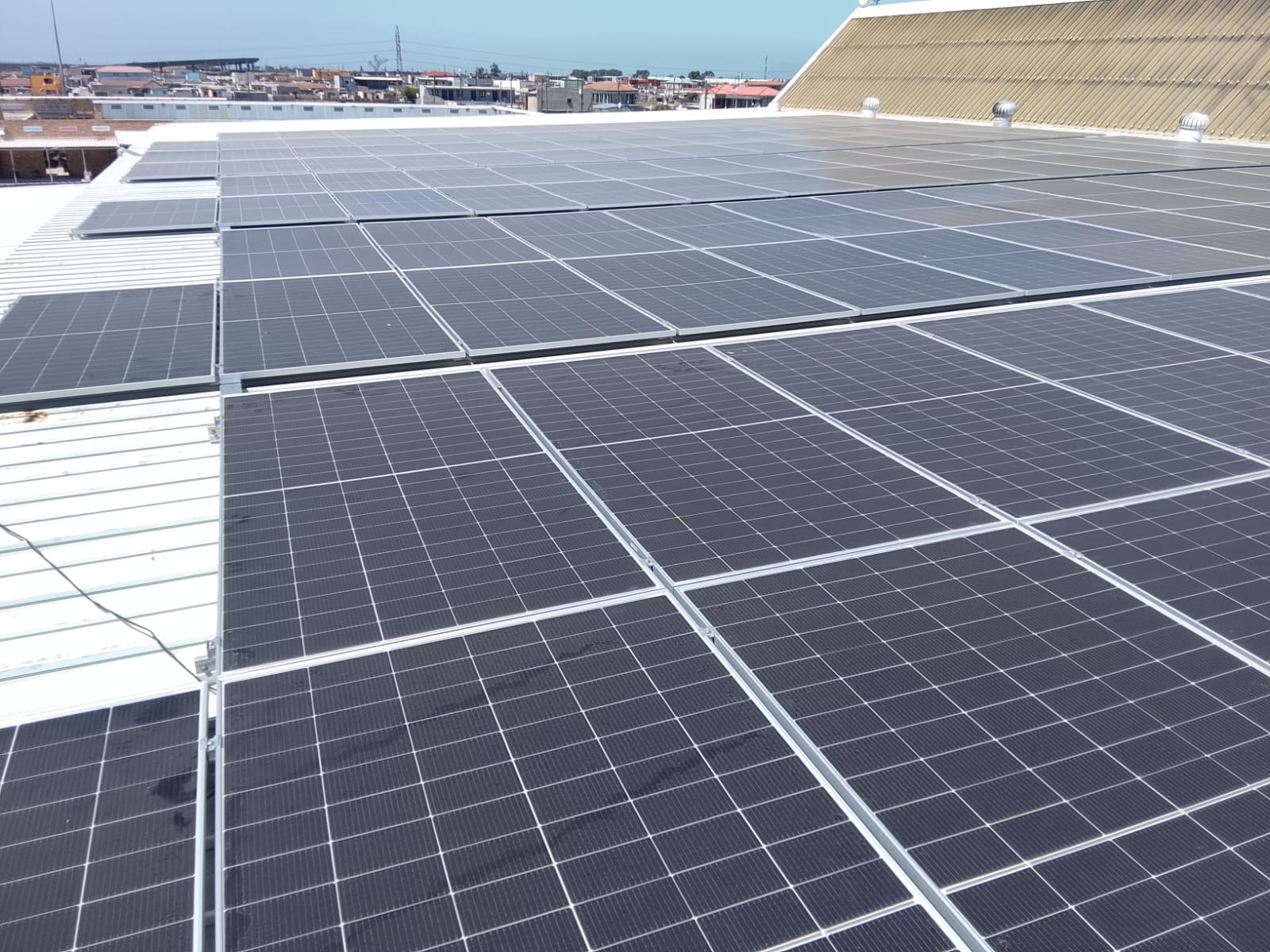 Commercial rooftop solar installation on corrugated metal roof